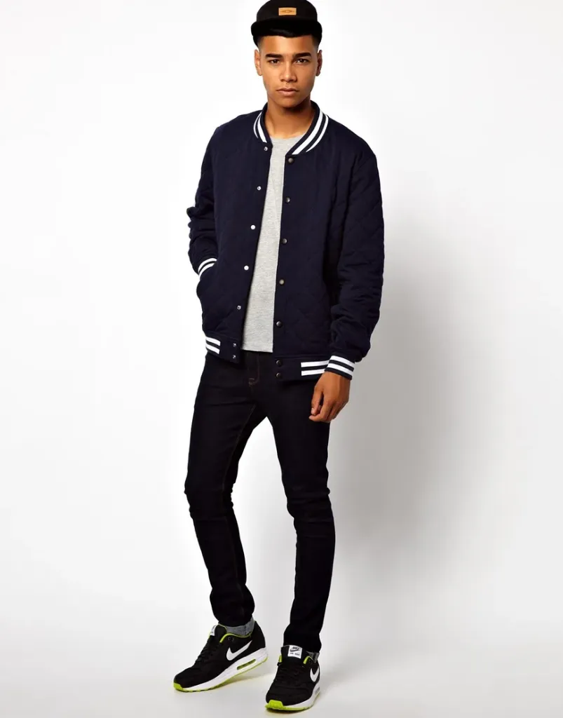 Street-Ready Cool: Varsity Jacket with Black Denim and Retro Sneakers